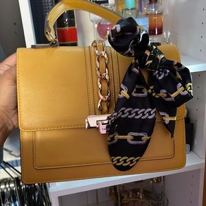 Yellow Aldo convertible bag with strap